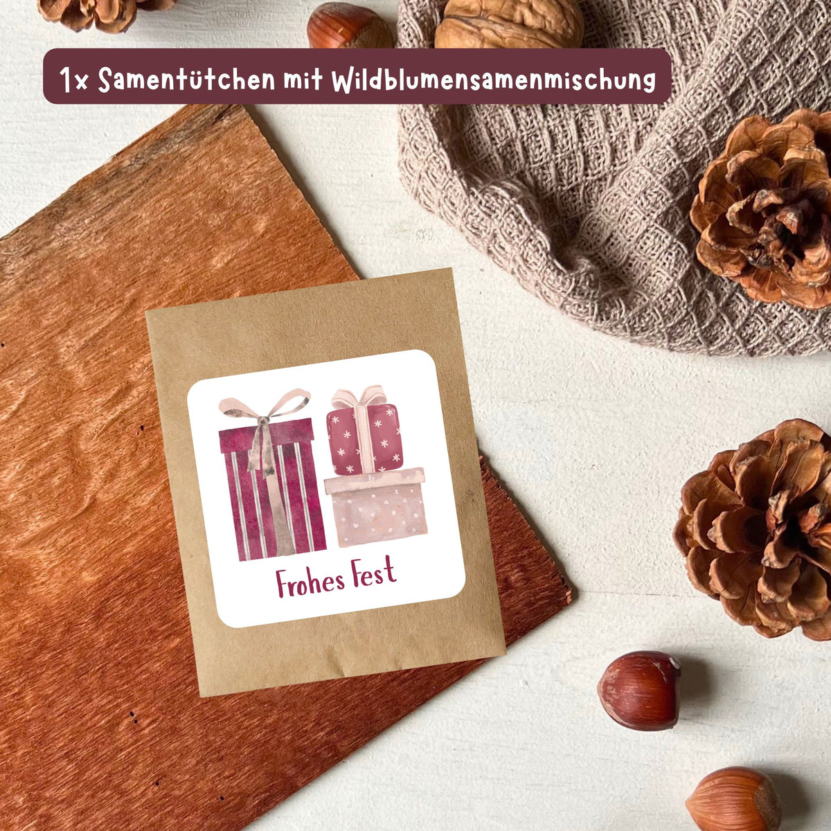 foodigence Samentütchen mit Wildblumensamen, winterlichen Geschenk-Illustrationen und dem Schriftzug „Frohes Fest“ als Adventskalender-Füllung und Weihnachtsgeschenk