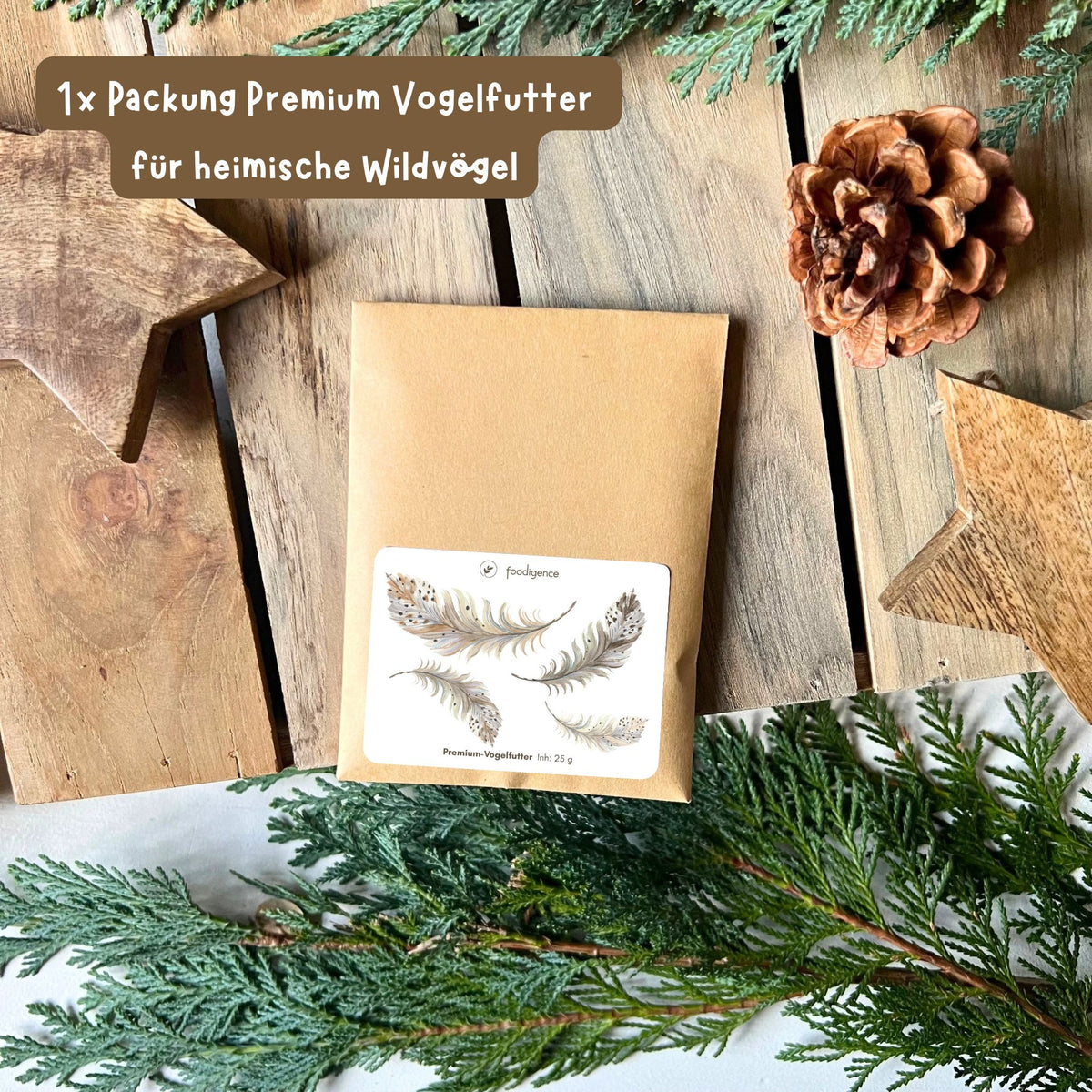 foodigence Premium-Vogelfutter für heimische Wildvögel mit liebevoll illustriertem Federmotiv als naturverbundene Adventskalender-Füllung und kleine Überraschung im weihnachtlichen Geschenkset