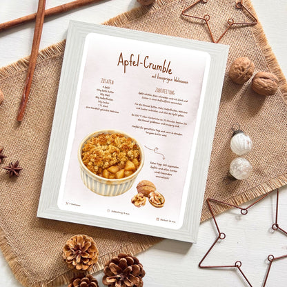 Apfelcrumble Rezeptkarte von foodigence platziert umgeben von weihnachtlichen Elementen