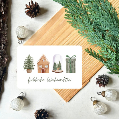 Karte mit weihnachtlichen Motiven (Tannenbaum, Lebkuchenhaus, Glaskugel, Geschenk) in grün/braun Design aus dem Weihnachtspostkarten Set von foodigence