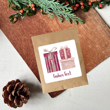 Samentütchen für Weihnachten oder andere festliche Anlässe mit Geschenken als Design in rosa und lila mit "frohes Fest" von foodigence
