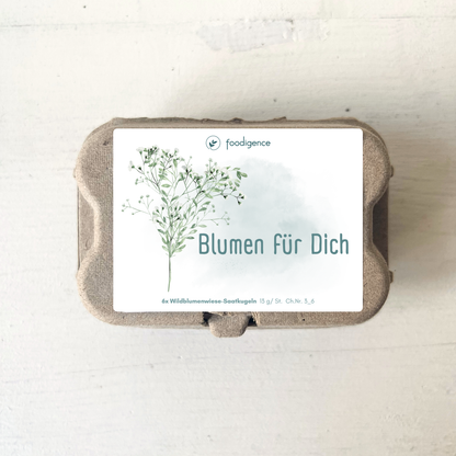 Saatkugelverpackung mit Aufschrift Blumen für Dich